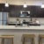 a kitchen with black cabinets